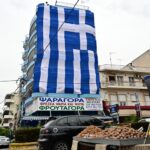 Giant Greek flag covered a seven -storey apartment building in Keratsini